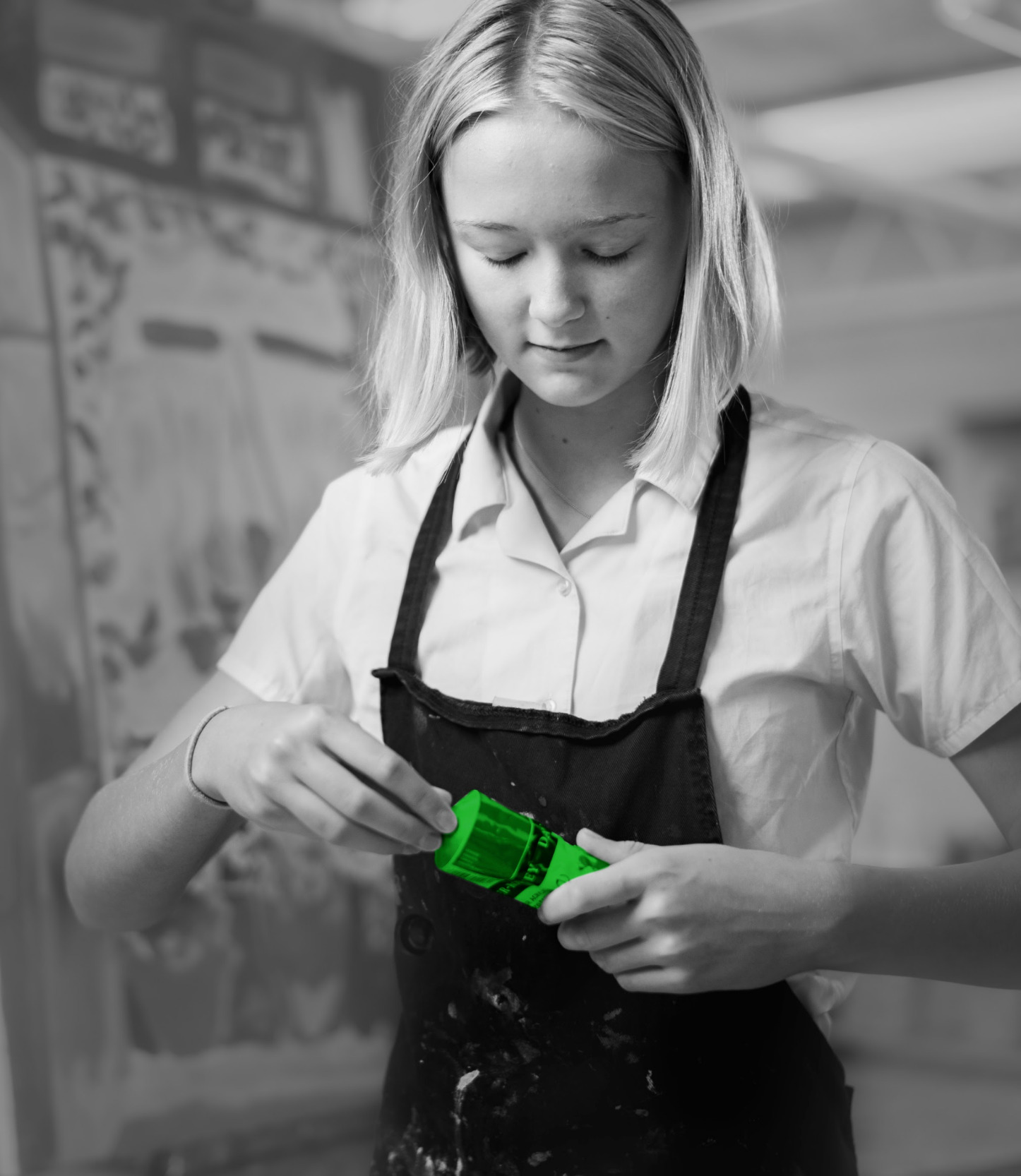 student holding paint