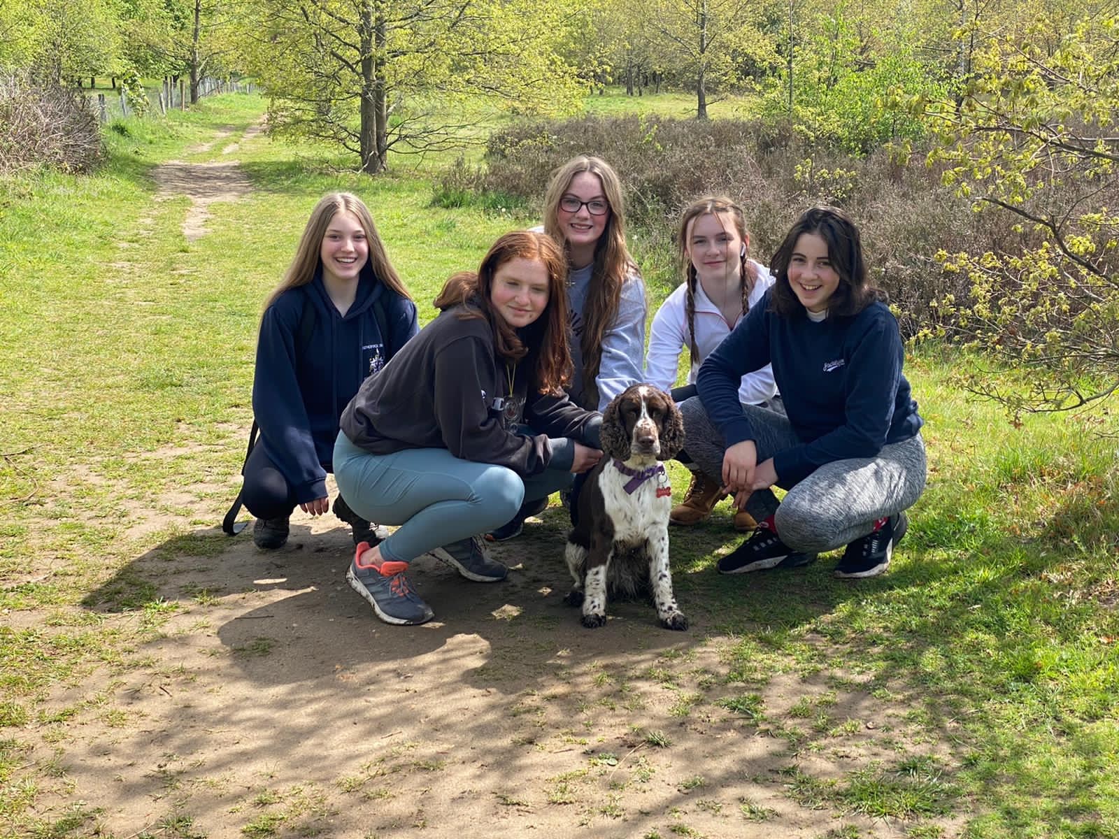 group of students with a dog