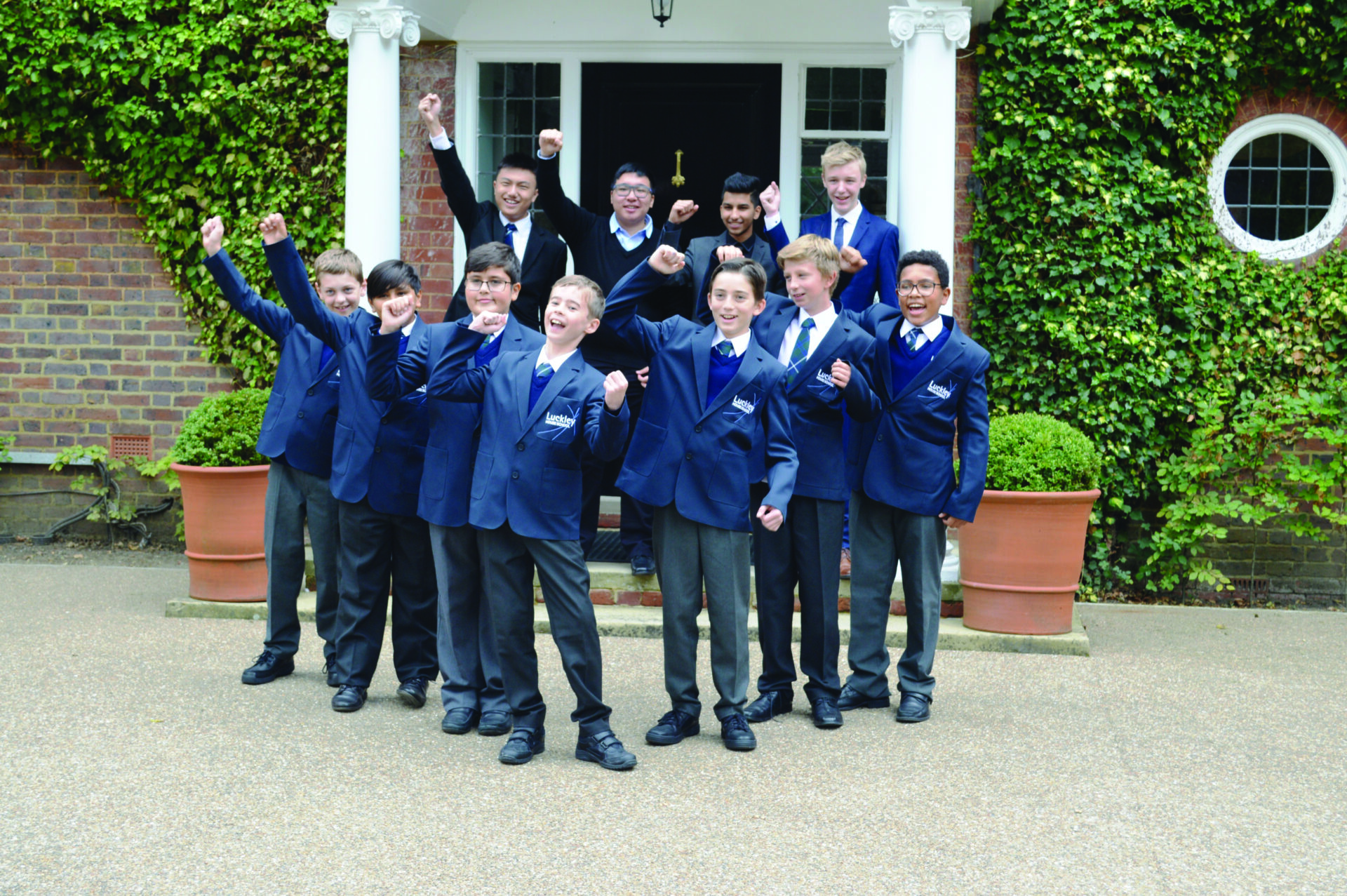 group of students in front of the school