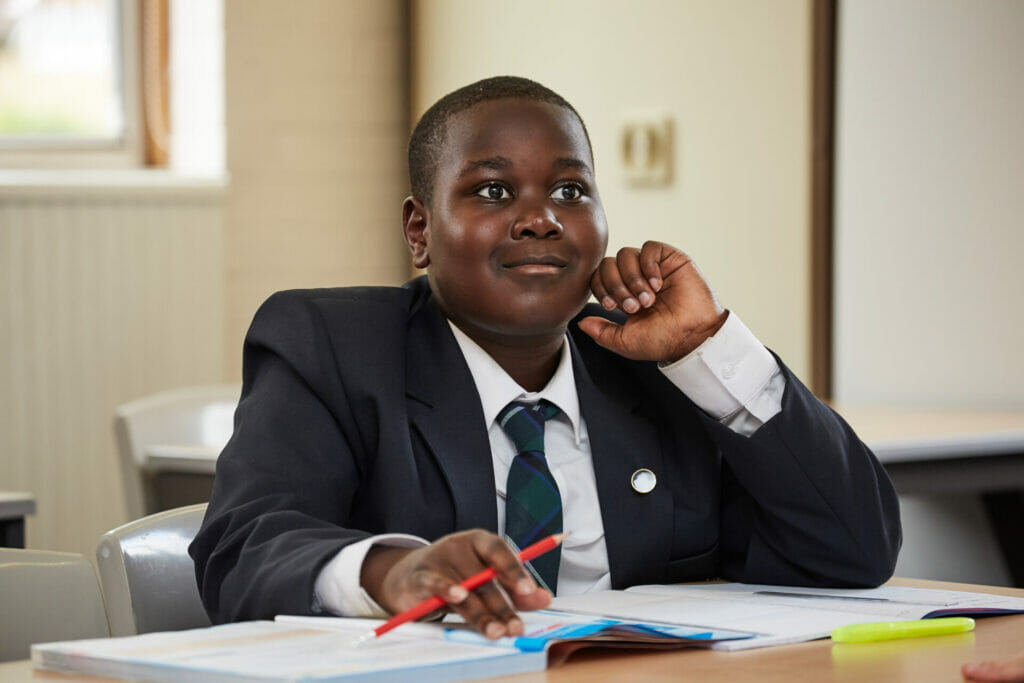 young boy studying