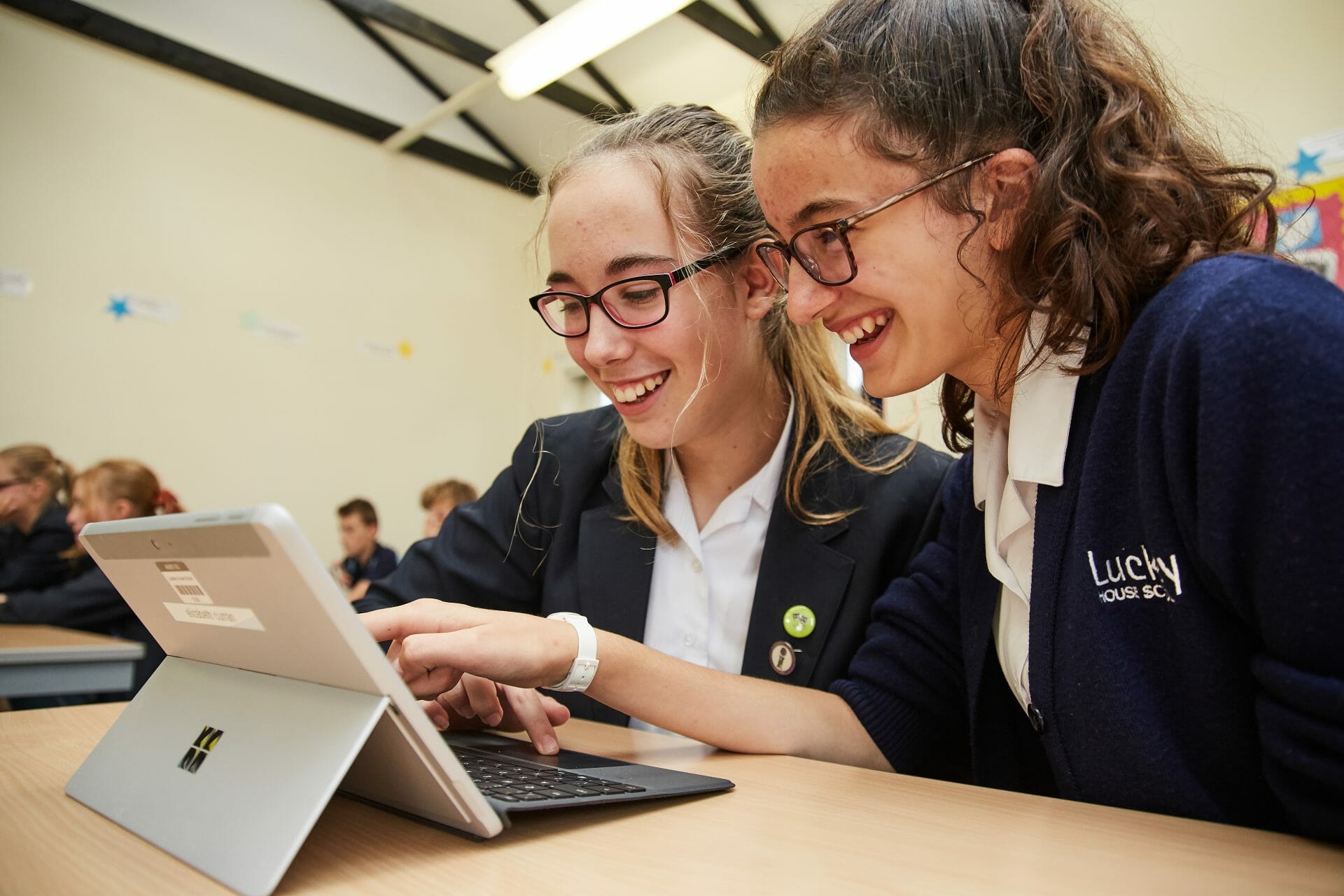 two girls using a tablet