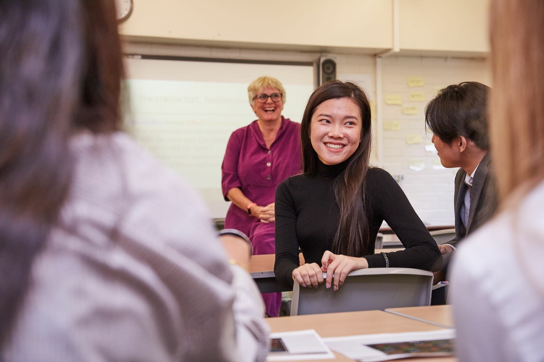 student turning around and smiling