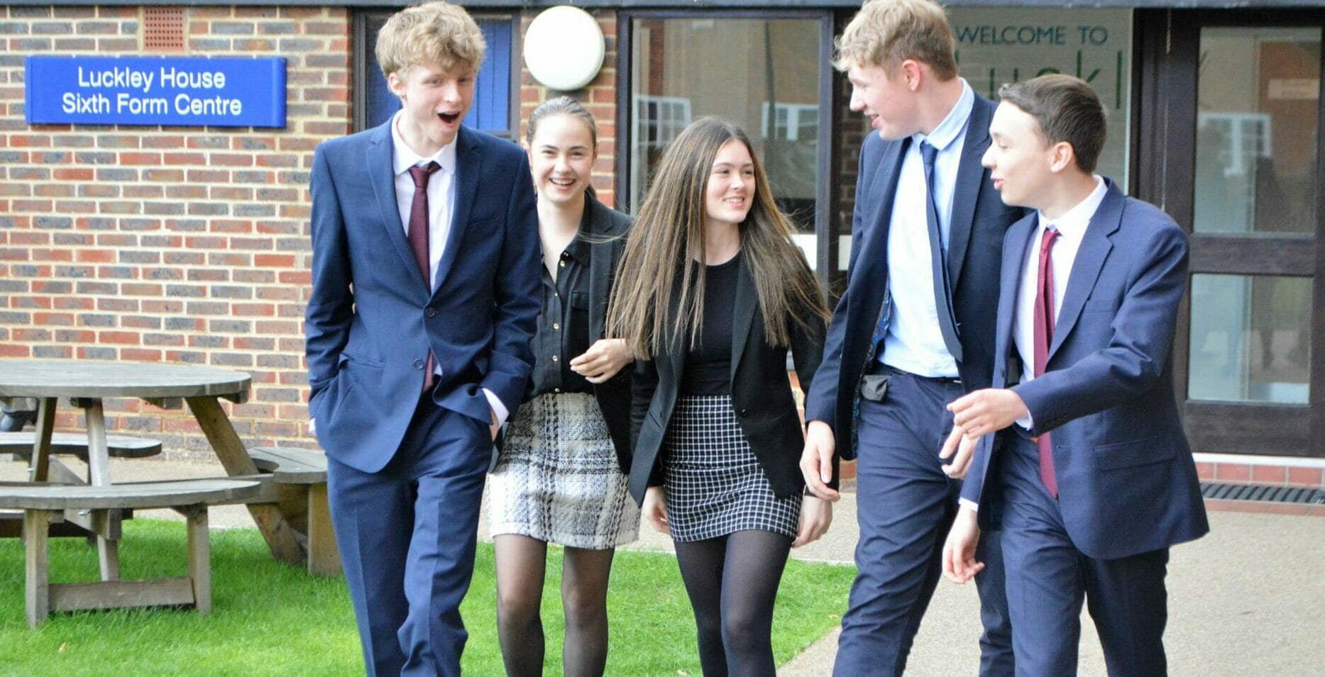 students in smart clothes walking