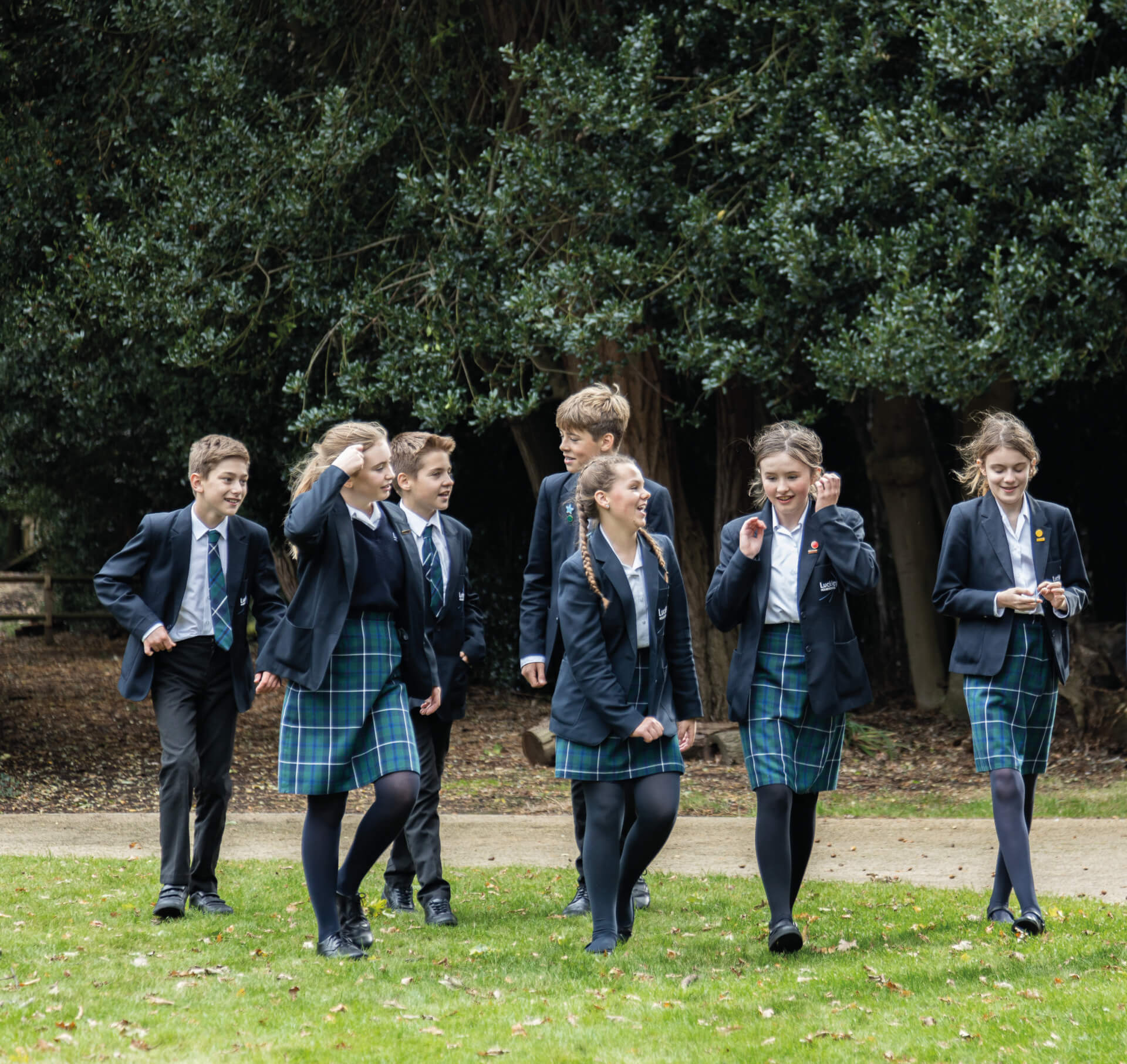 children walking across a field