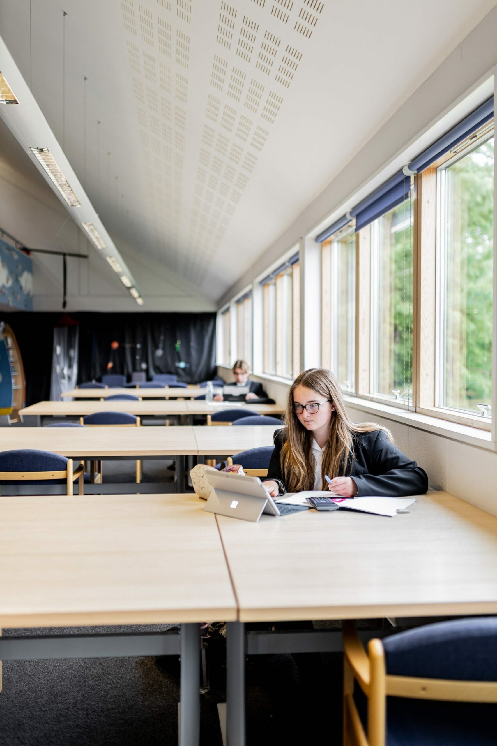 student working at her desk