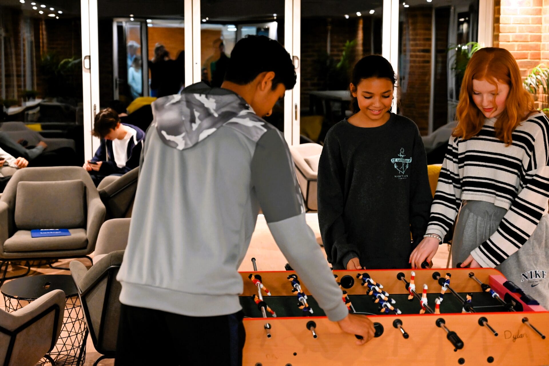 students playing foosball