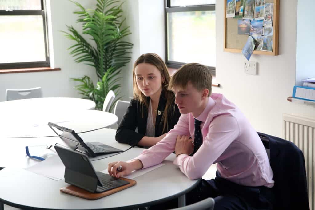 2 students using iPads